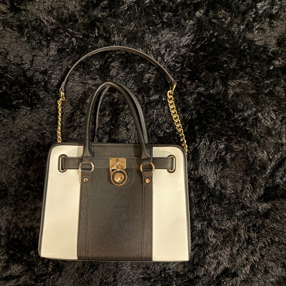 Elegant Black and White Handbag with Gold Accents